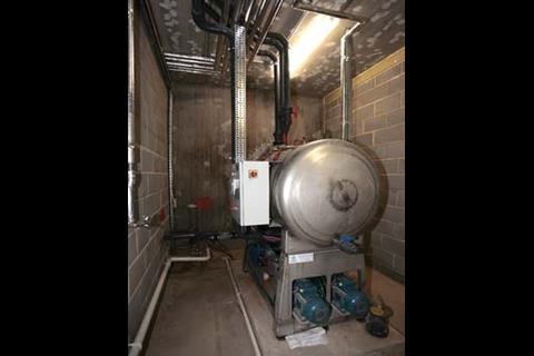 Vacuum drainage system uses rainwater for toilet flushing.